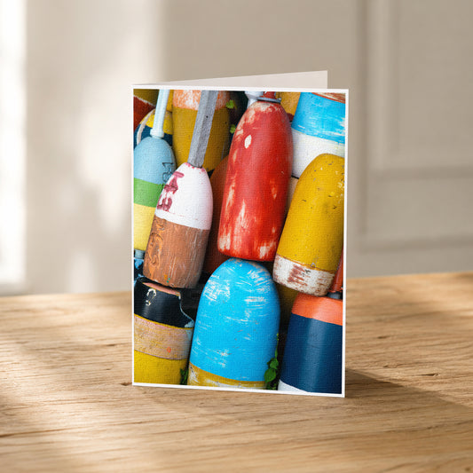 A collection of colorful buoys and buoys on a wooden surface.
