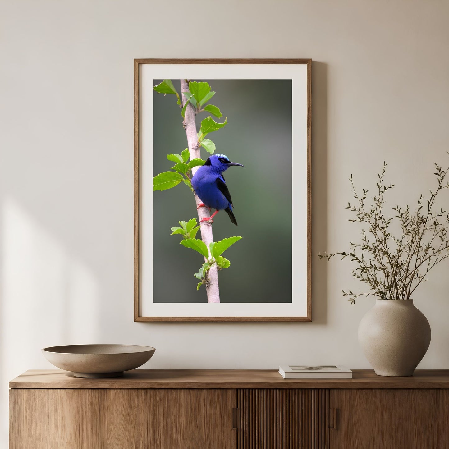 Red-legged honeycreeper tropical bird photograph in a wood frame, styled as vertical nature wall art for a warm modern interior.