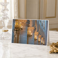 A framed photograph of ornate columns and chandeliers in a grand, historic building, likely a church or cathedral.