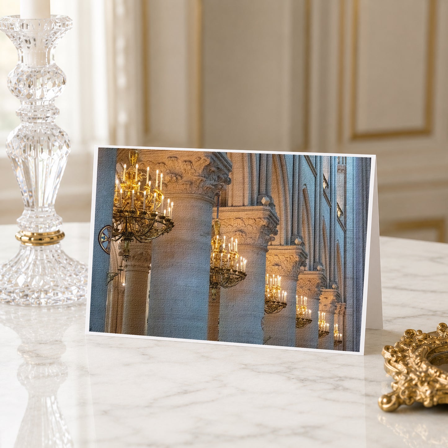 A framed photograph of ornate columns and chandeliers in a grand, historic building, likely a church or cathedral.
