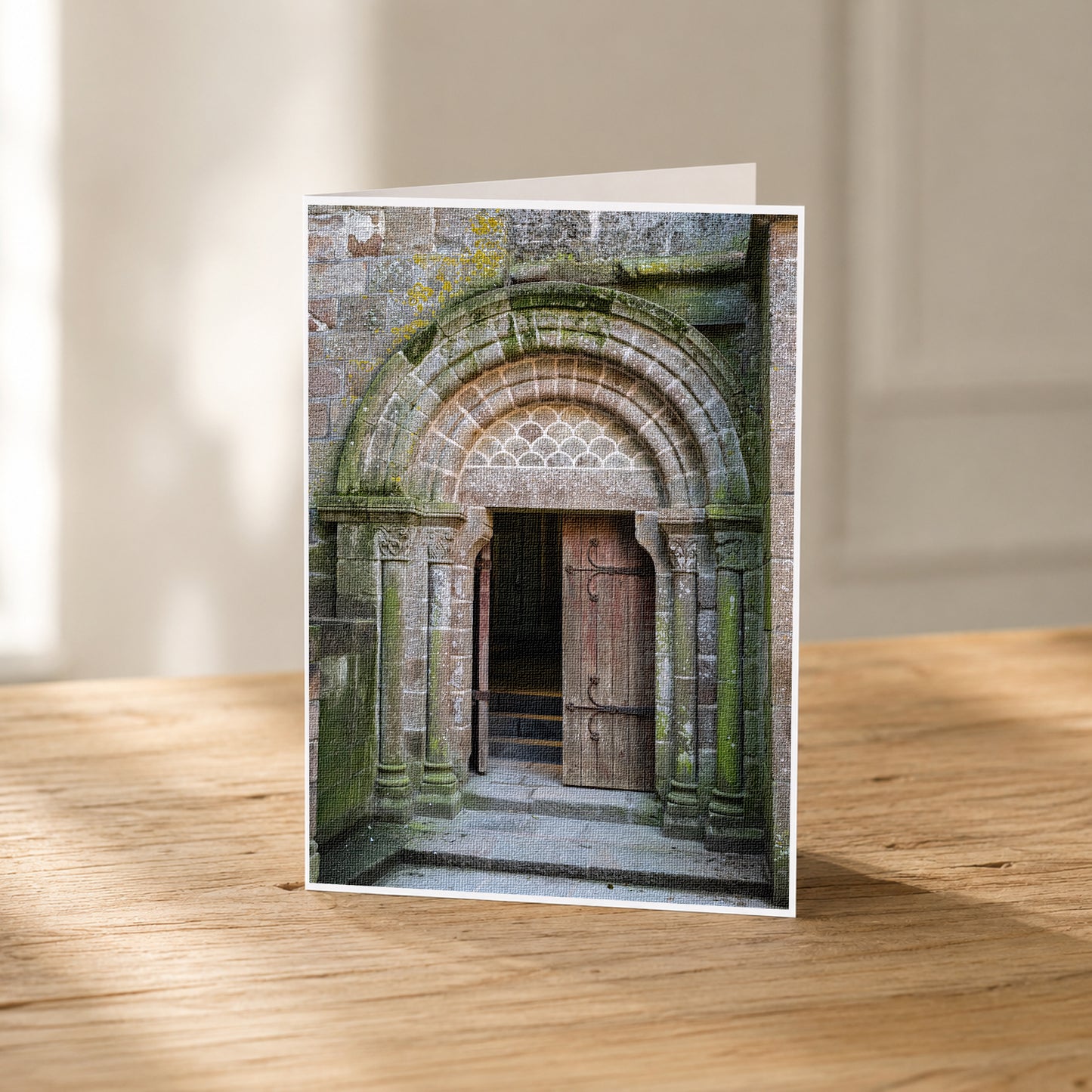 A wooden door with a stone archway, set in a mossy stone wall, is the focal point of the image.