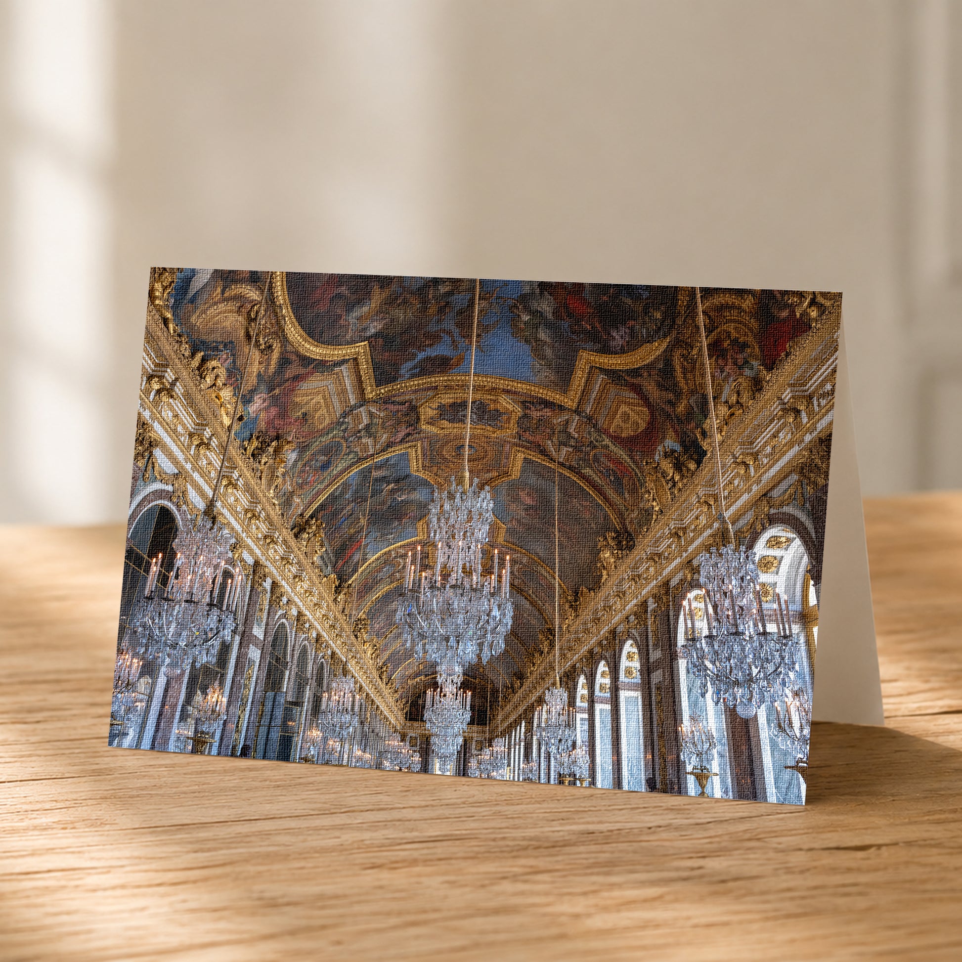 a grand, ornate hall with intricate gold and blue decorations, chandeliers, and a high ceiling with elaborate patterns.