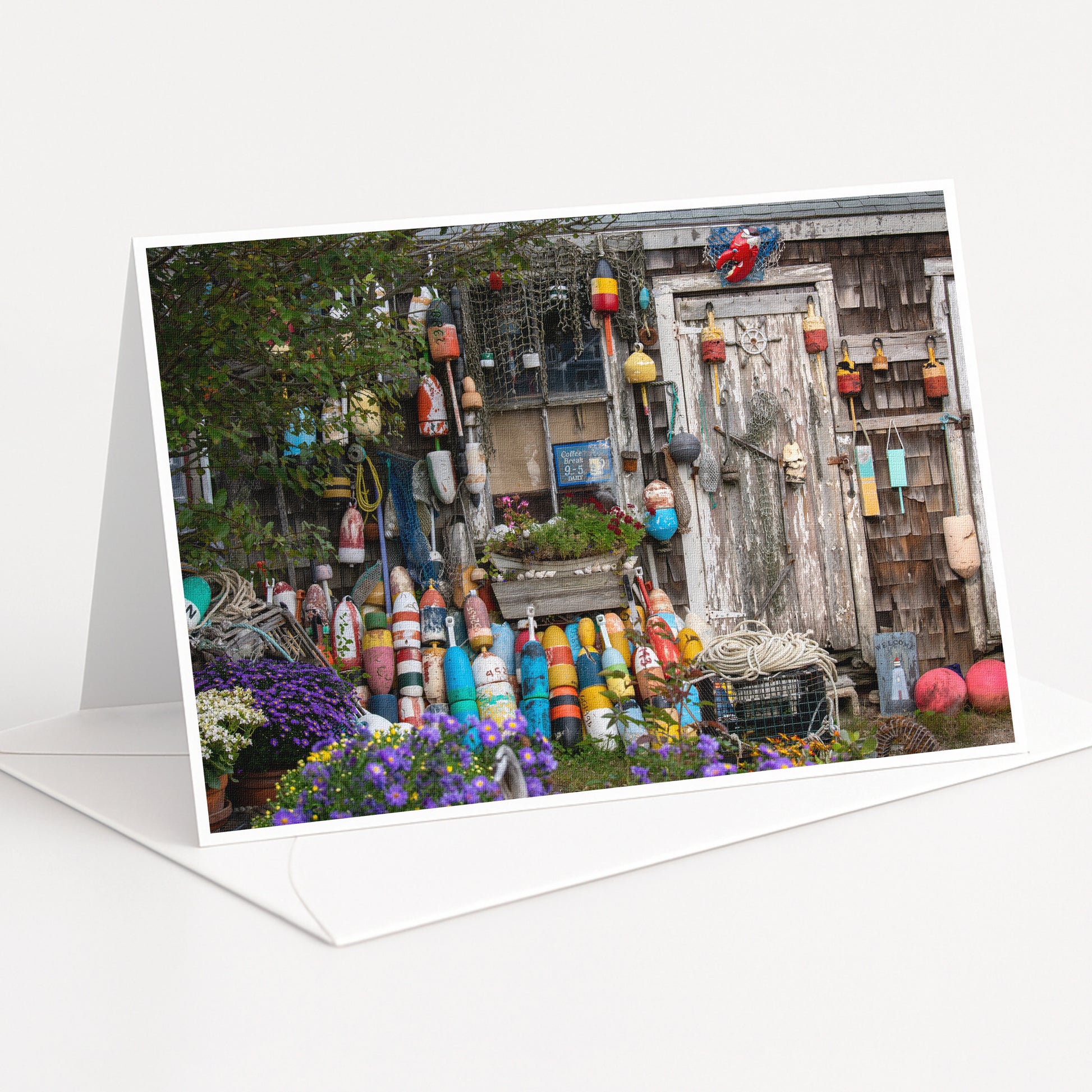 A colorful display of various objects, including buoys, vases, and other decorative items, set against a backdrop of a wooden structure.