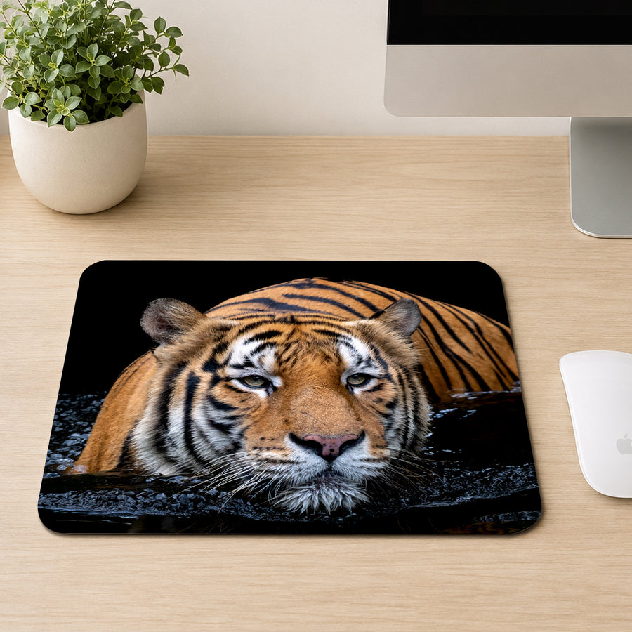 Malayan tiger resting in dark water with intense eyes and wet whiskers, printed on a mouse pad