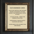 a framed sign with text stating that all cards are printed on luxurious linen and that the cardstock and envelope come with a matching cellulose bag.