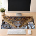 Hall of Mirrors desk mat featuring original Palace of Versailles photography by Linda Nee, shown beneath a white keyboard on a light wood desk.