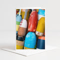 A collection of colorful buoys and buoys in various shapes and sizes, creating a vibrant and visually interesting display.