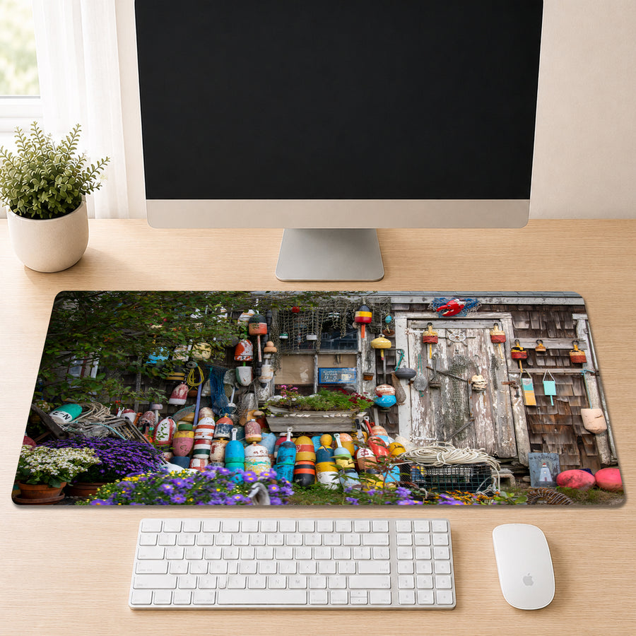 a computer monitor displaying a colorful collage of various objects, including a garden scene, a building, and a collection of colorful objects.