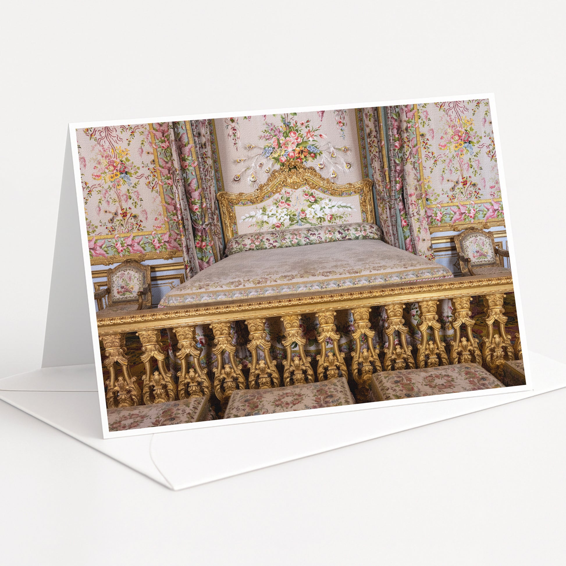 an ornate, gilded bed with intricate floral patterns and gold accents, set against a backdrop of a wall with a floral tapestry.