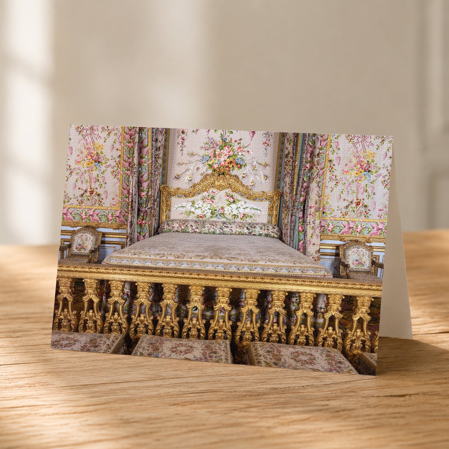 A photograph of an ornate, intricately decorated bed with gold-colored headboard and footboard, surrounded by floral patterns and curtains.