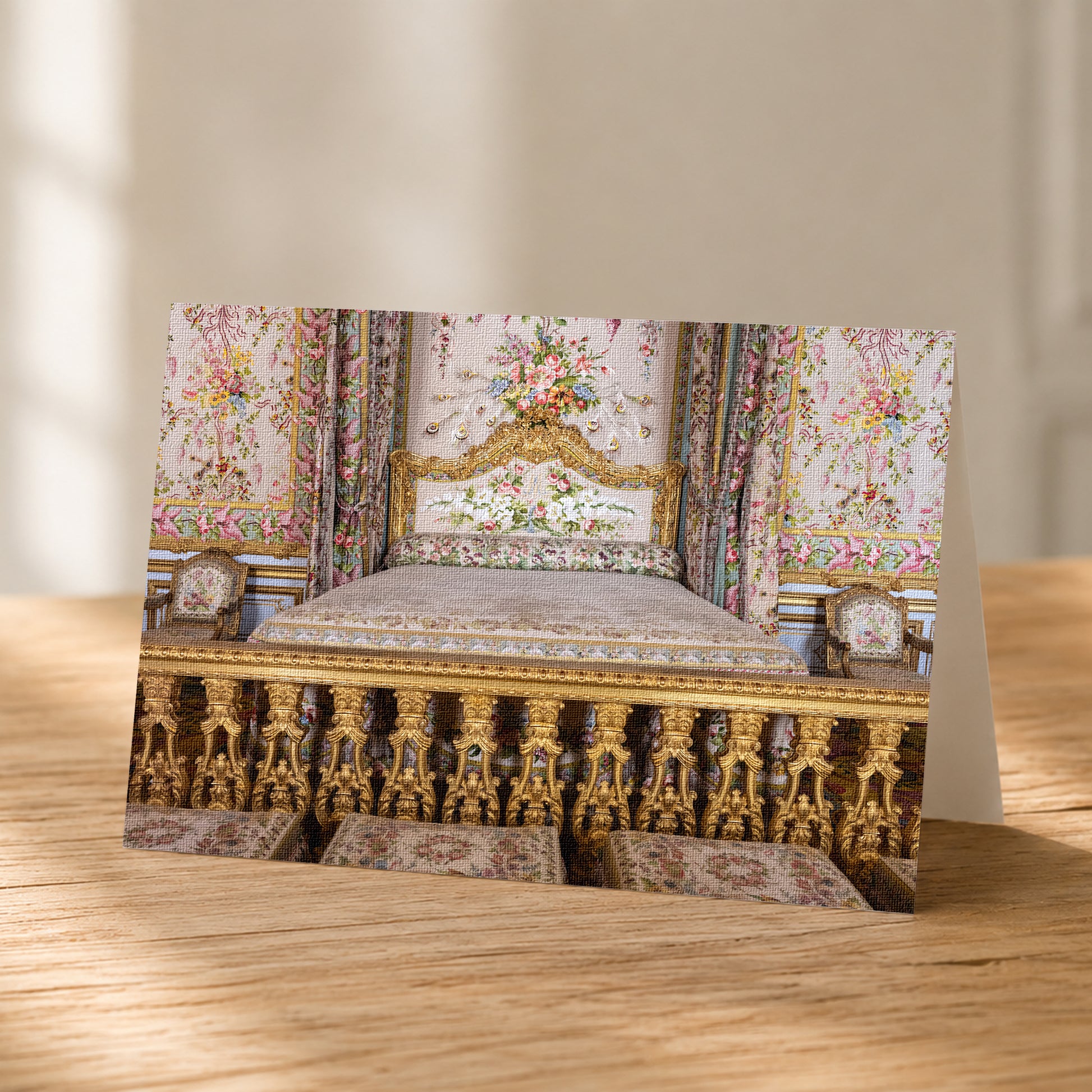 A photograph of an ornate, intricately decorated bed with gold-colored headboard and footboard, surrounded by floral patterns and curtains.