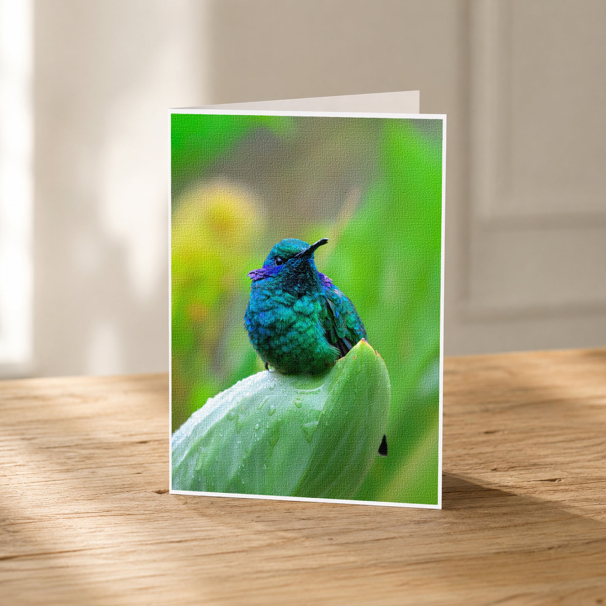 A vibrant green hummingbird perches on a leaf, its iridescent feathers glistening in the light.