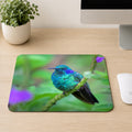 Lesser Violetear hummingbird with iridescent blue-green feathers perched on a flowering stem with purple blossoms, printed on a mouse pad